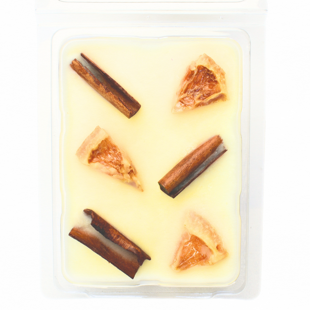 Ceras derretidas con aceites esenciales de naranja y canela
